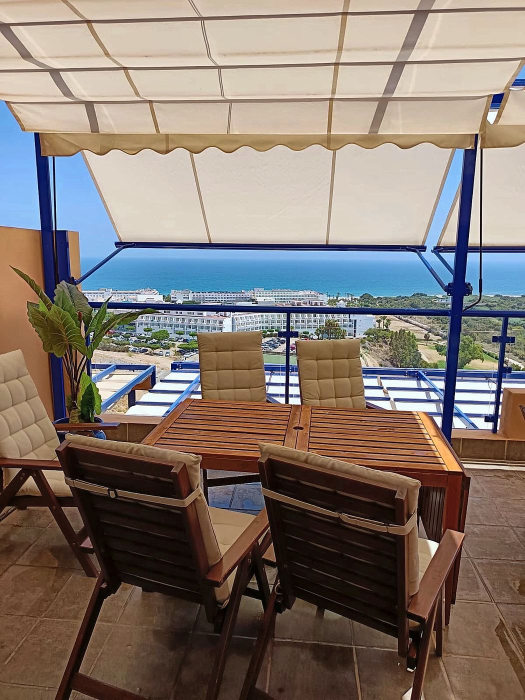 Dining table on the terrace facing the sea