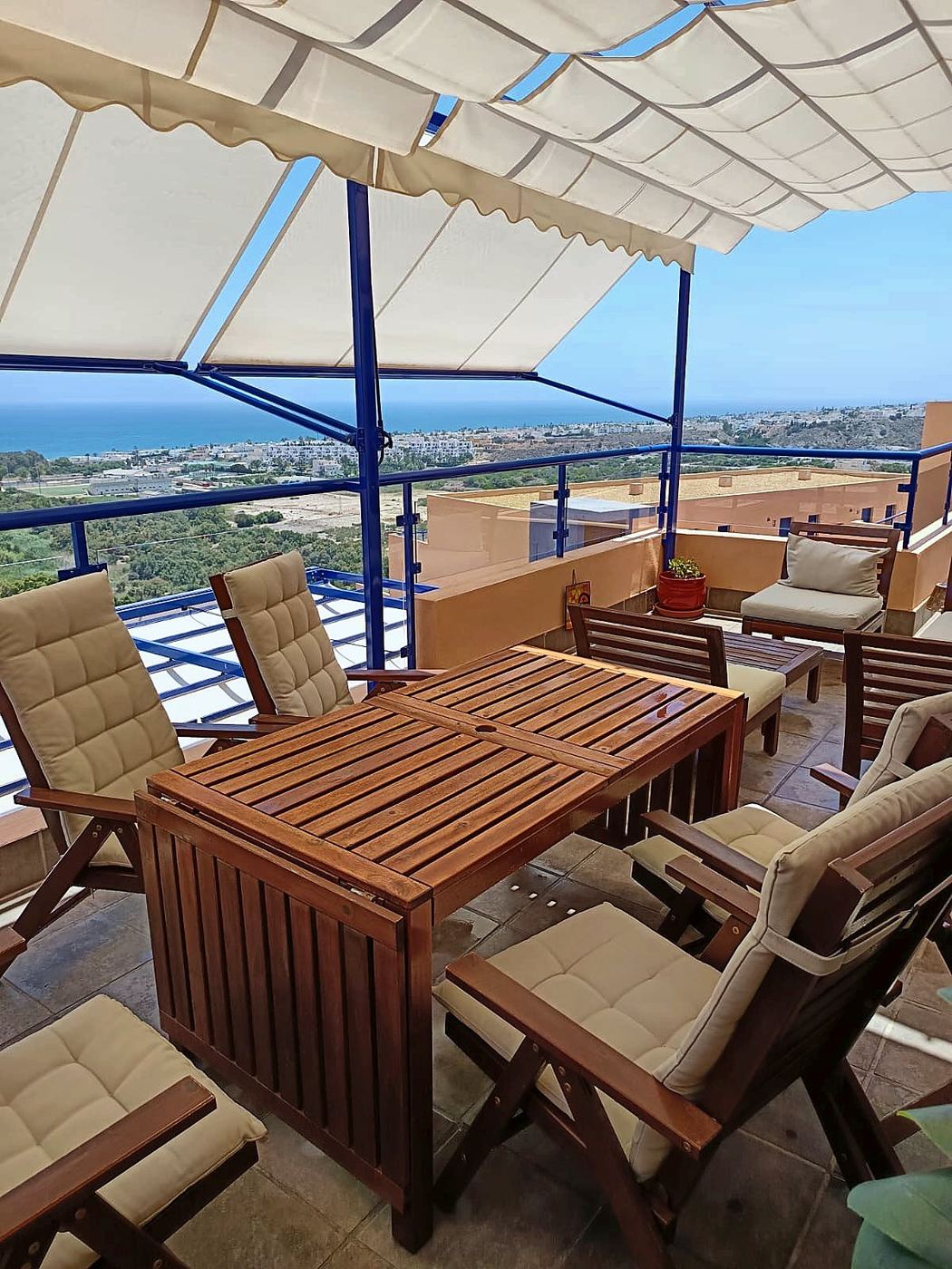 Terrace dining area with coast panorama